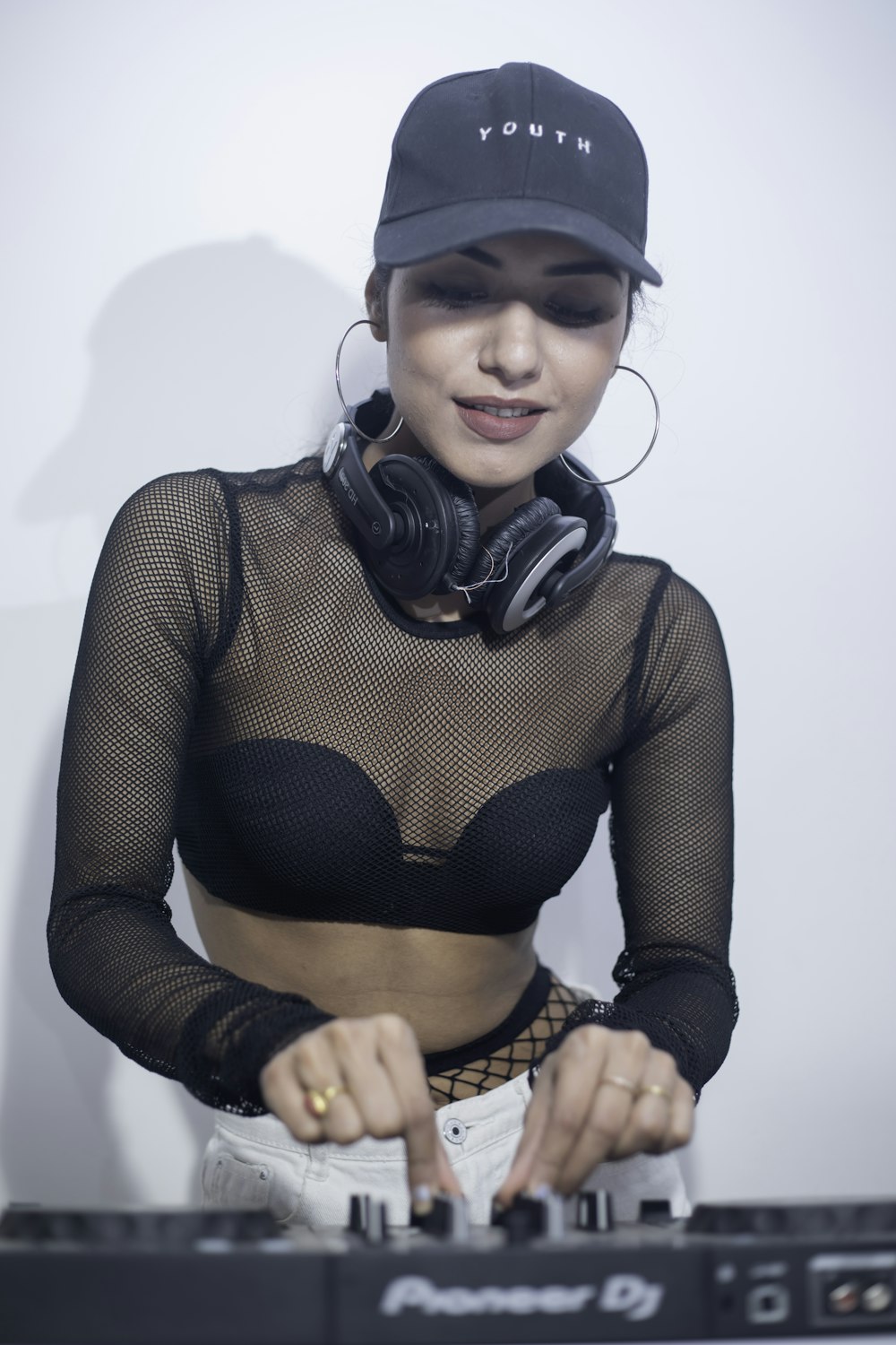 a woman wearing headphones and a black top