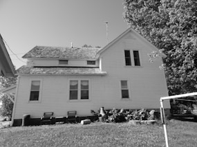 a black and white photo of a house