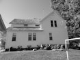 a black and white photo of a house
