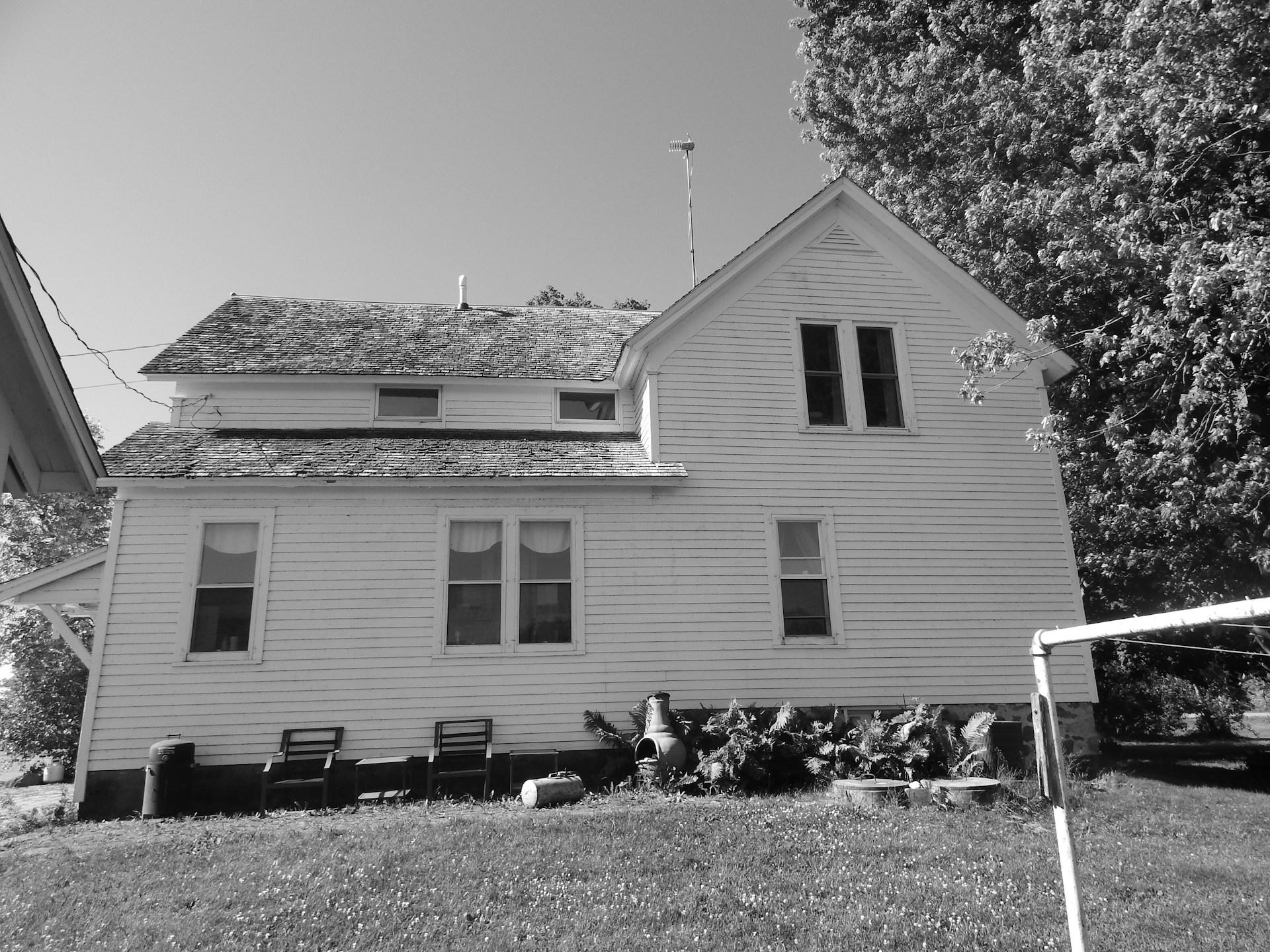 a black and white photo of a house