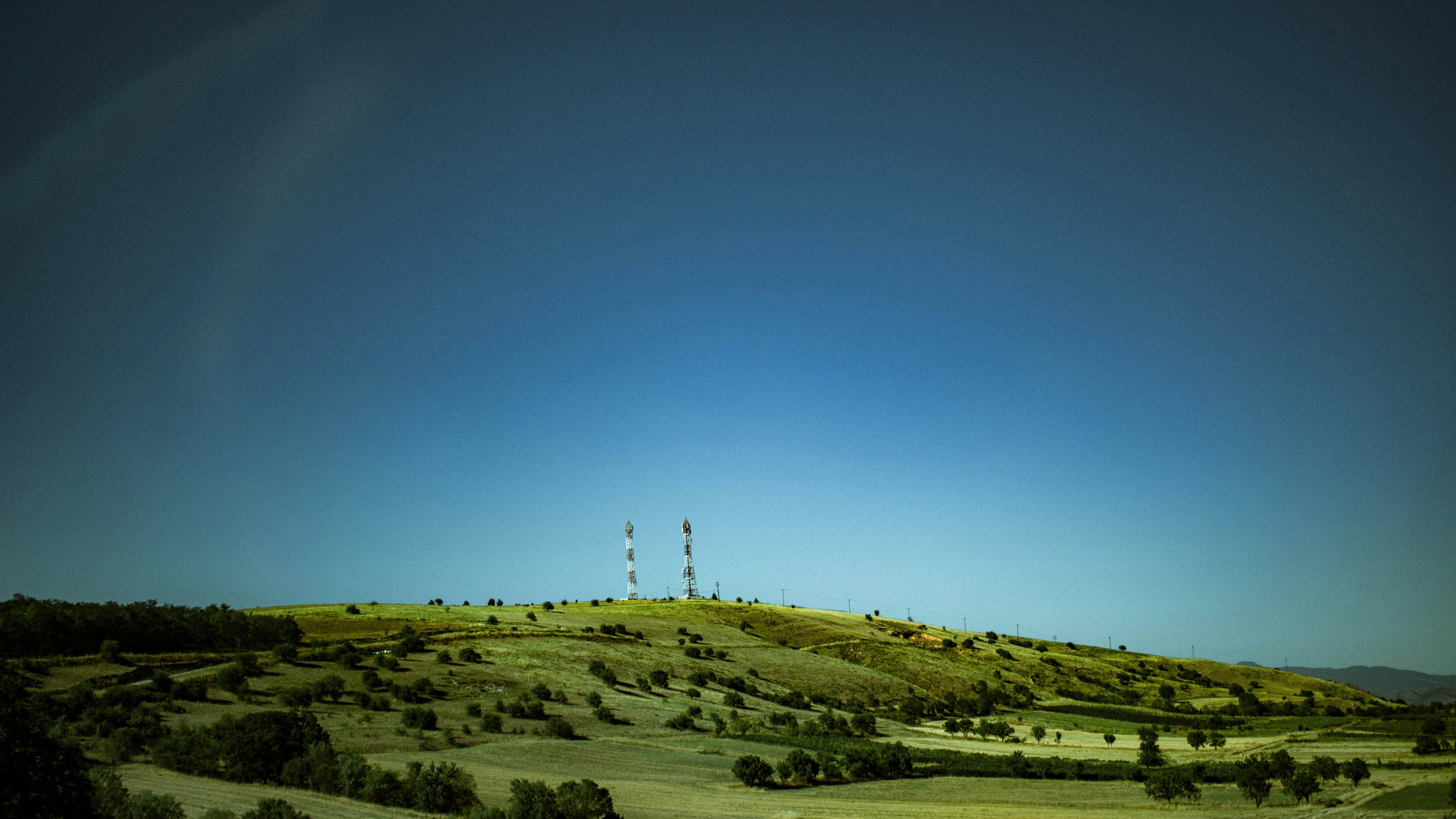 a hill with a radio tower on top of it