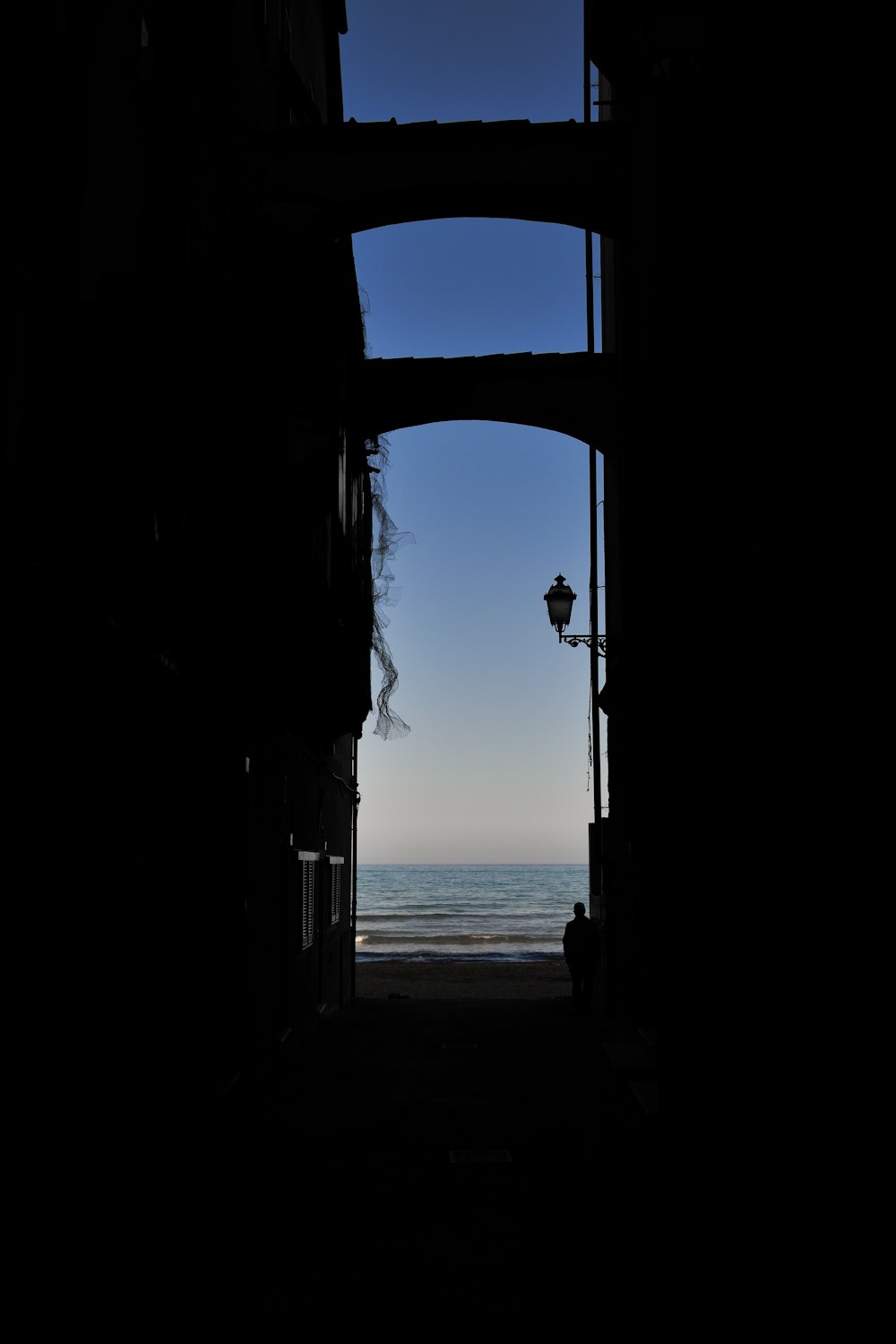 a view of the ocean through an open door