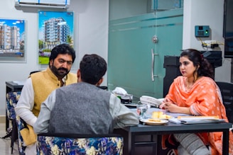 a group of people sitting around a table