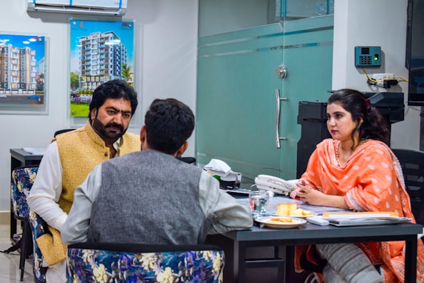 a group of people sitting around a table