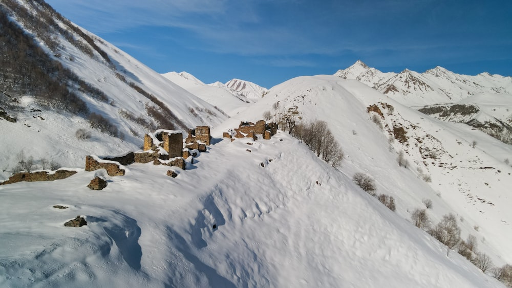 a snow covered mountain with a bunch of rocks on top of it