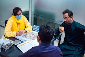 a group of people sitting around a table