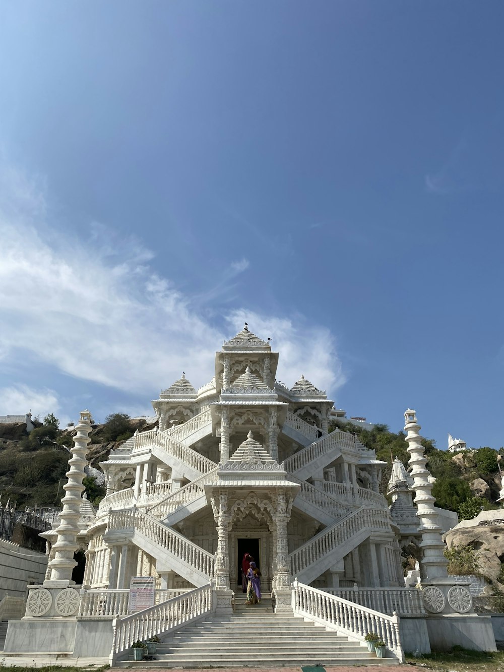 a large white building with stairs leading up to it