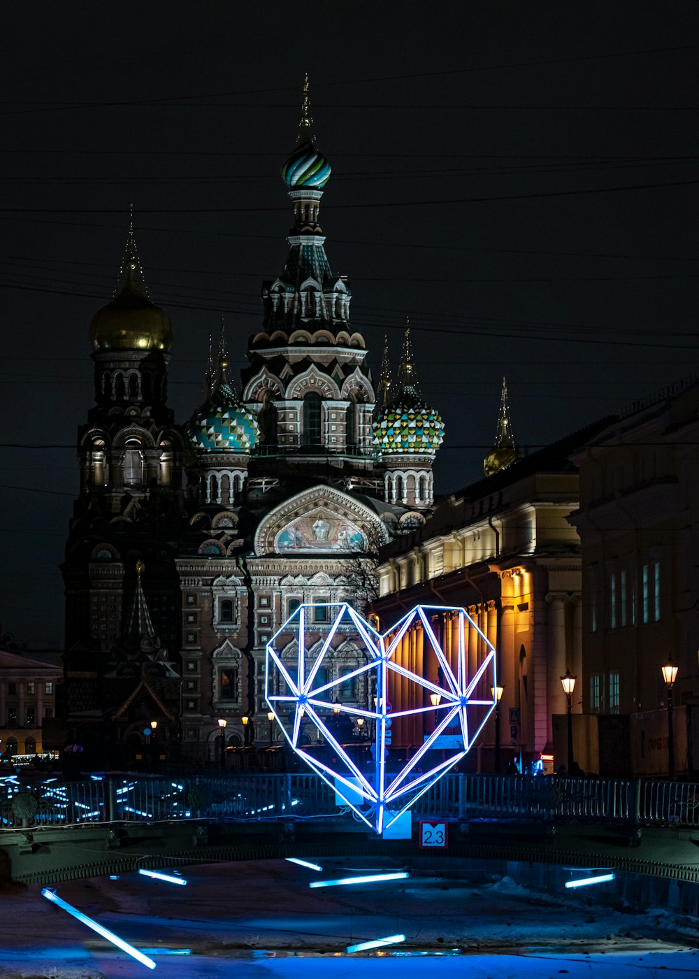 a large building with a heart shaped object in front of it