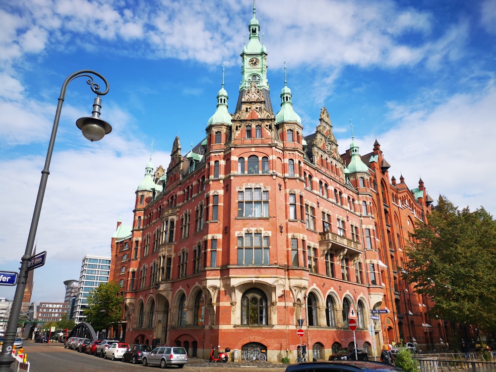 a large red brick building sitting on the side of a road