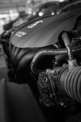 a black and white photo of a car engine