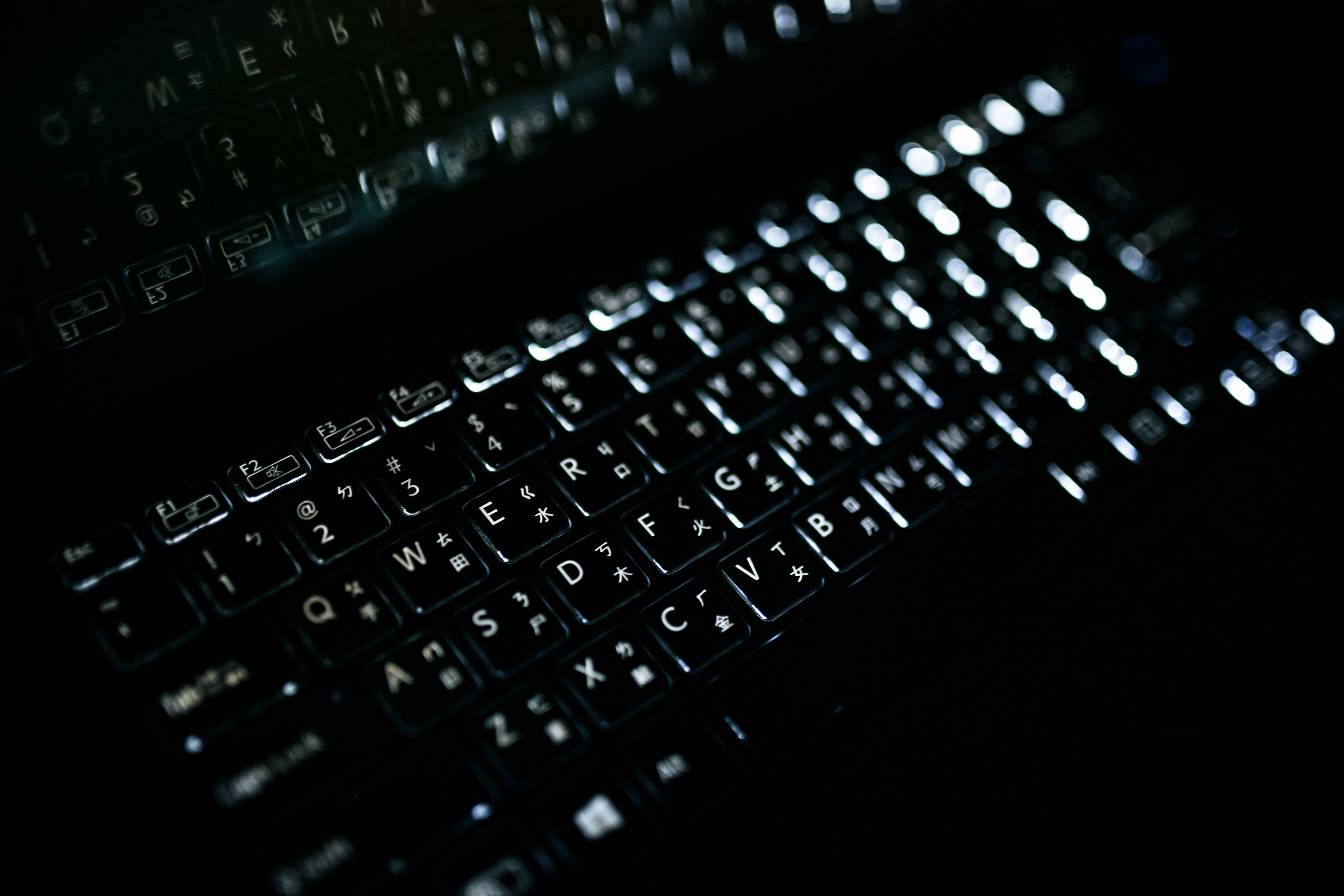 a close up of a keyboard in the dark