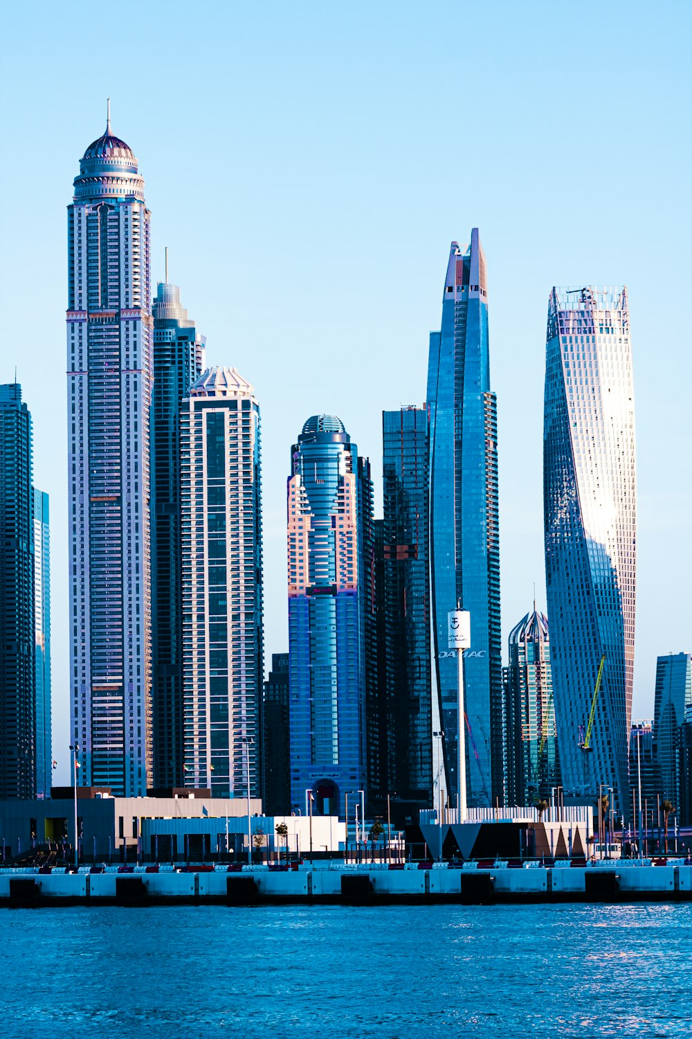 a large body of water with a bunch of tall buildings in the background