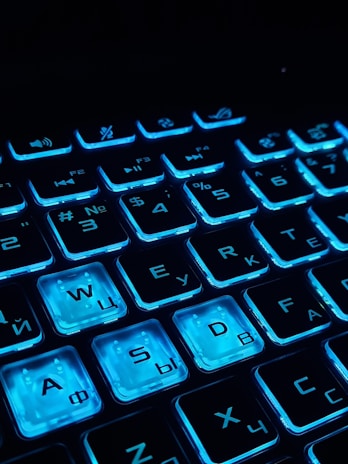 a close up of a keyboard with blue keys