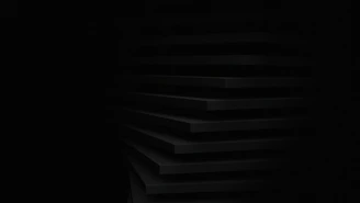 a black and white photo of a dark room