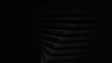 a black and white photo of a dark room