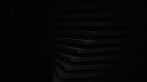 a black and white photo of a dark room