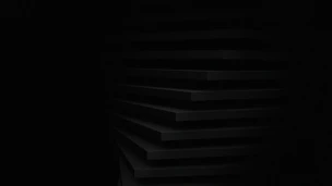 a black and white photo of a dark room