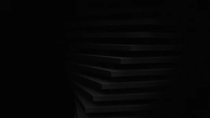 a black and white photo of a dark room