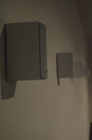 An artistic shot of sound speakers stacked neatly with soft ambient light highlighting their curves.