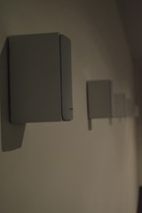 Sound system speakers mounted on walls in a conference room