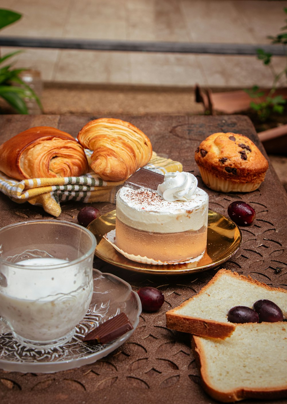 a table topped with bread and pastries on top of a table