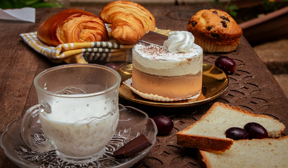 a table topped with a cake and a cup of coffee