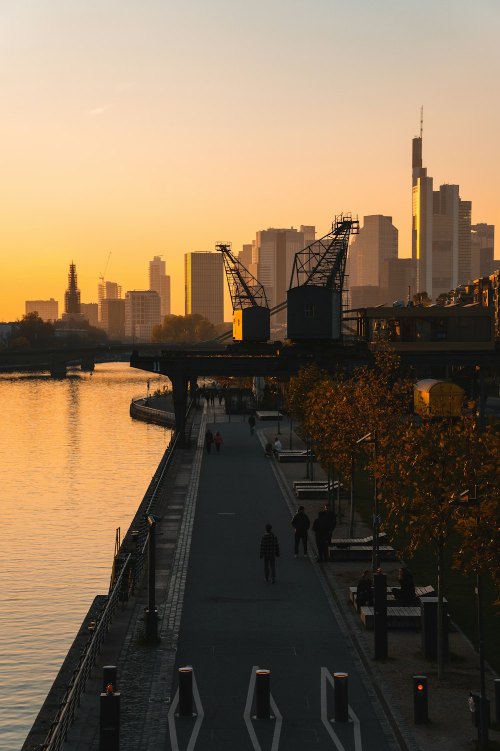 a bridge over a body of water with a city in the background