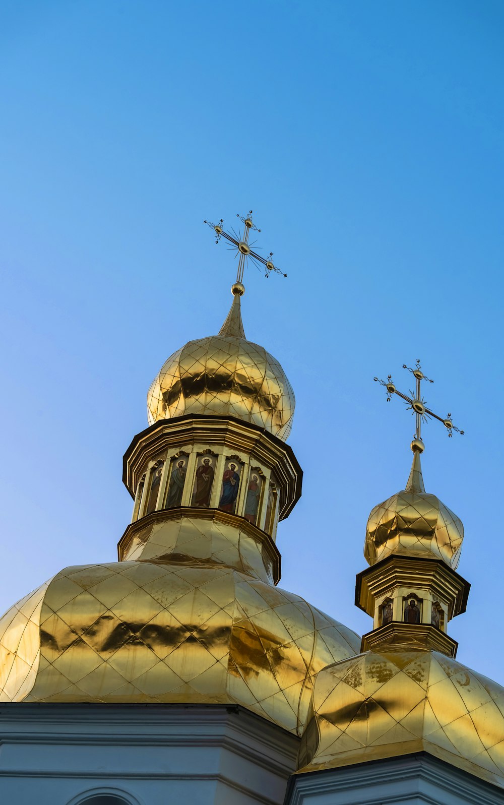 a golden dome with crosses on top of it