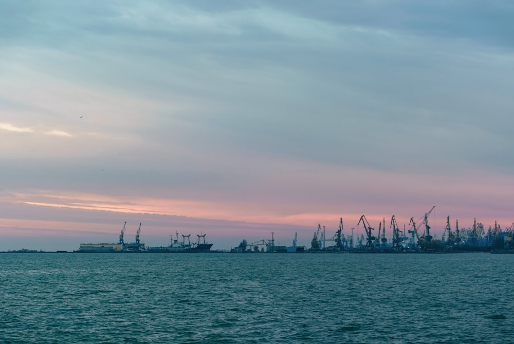 a large body of water with a bunch of ships in the background