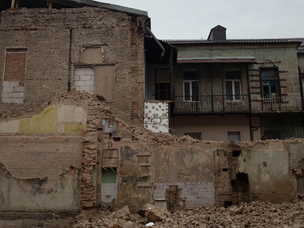 an old building with a bunch of rubble in front of it