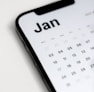 a close up of a cell phone with a calendar on it