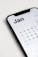 a close up of a cell phone with a calendar on it
