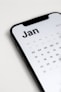 a close up of a cell phone with a calendar on it