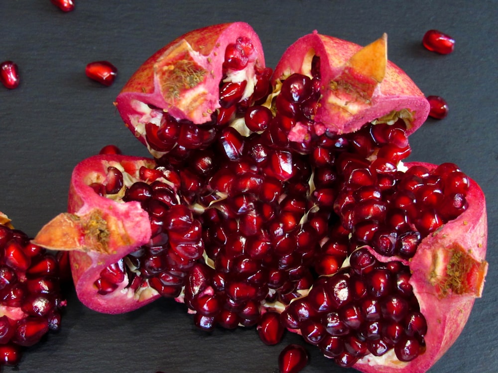 a pomegranate cut in half on a table