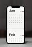 a calendar phone case sitting on top of a table