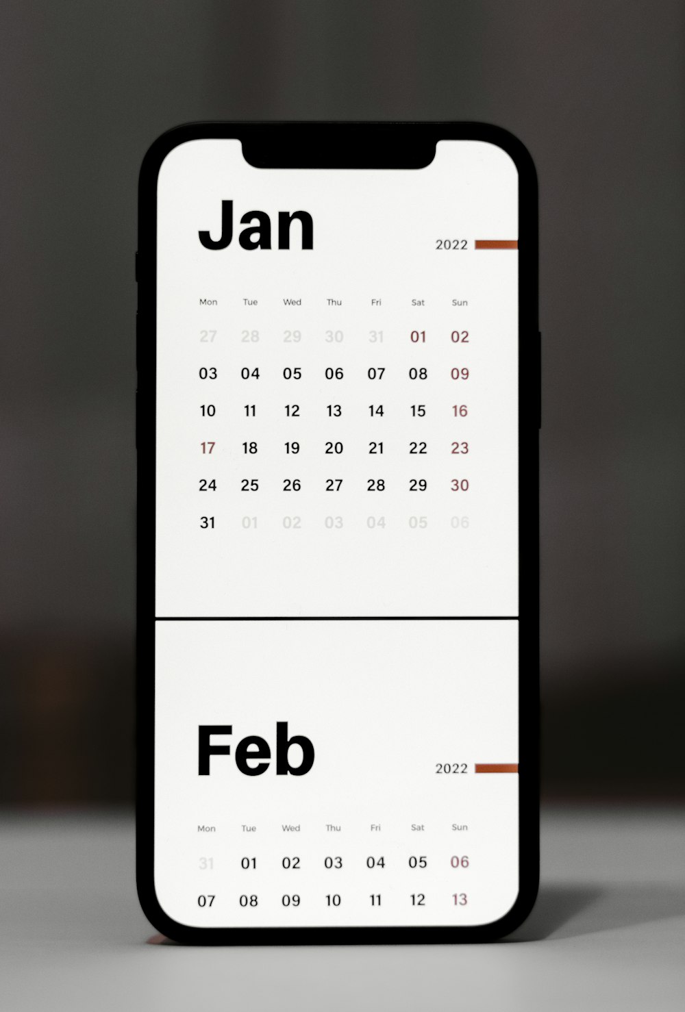 a calendar phone case sitting on top of a table