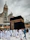 A group of happy pilgrims walking near the Prophet's Mosque in Medina