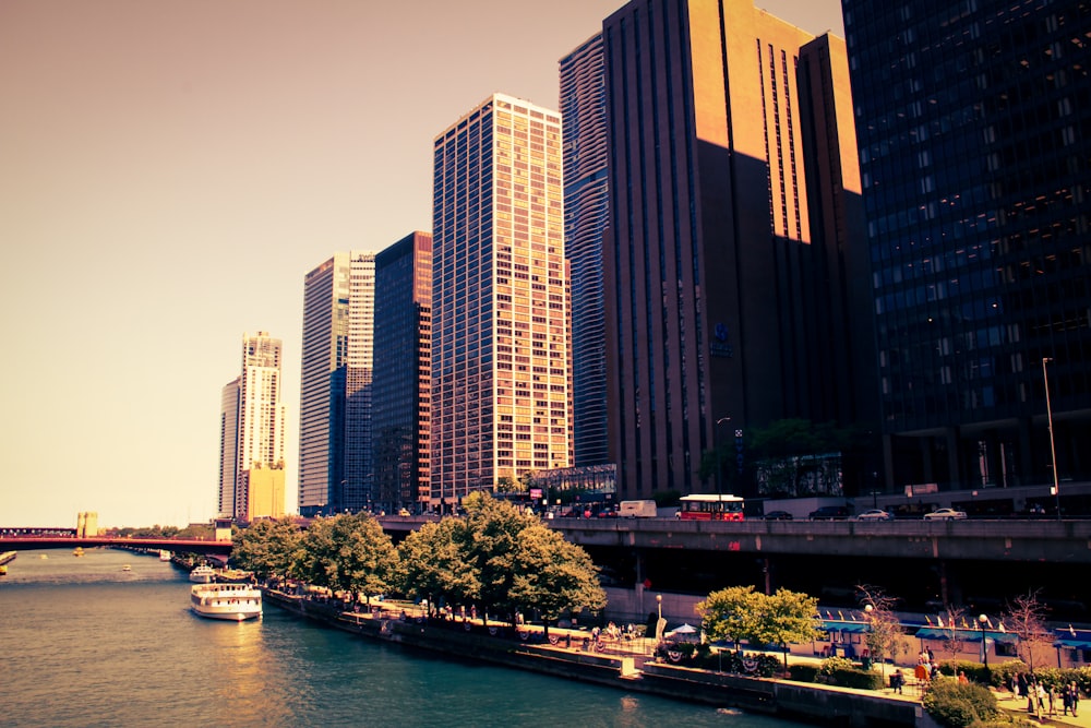 a river running through a city next to tall buildings