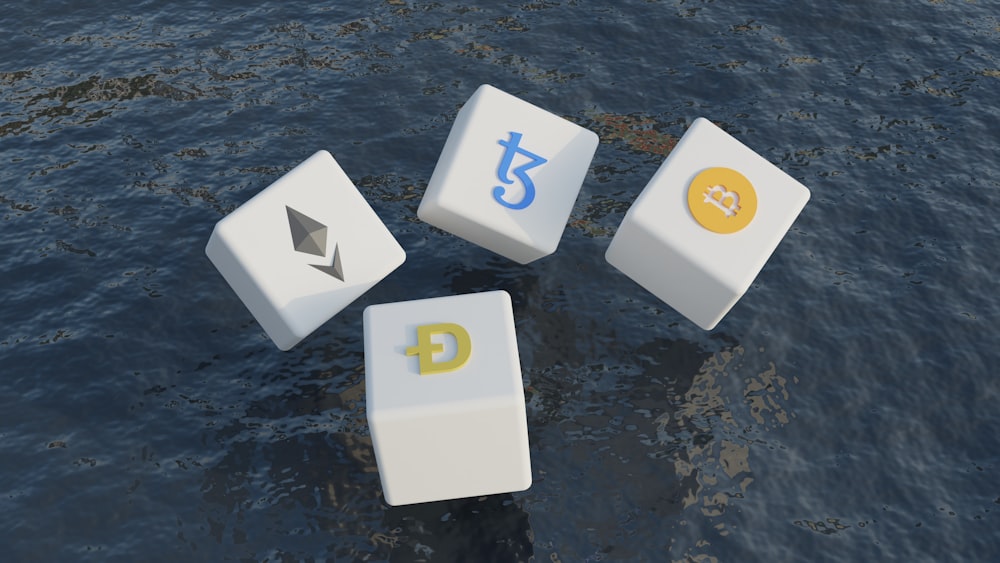 a group of dices floating on top of a body of water