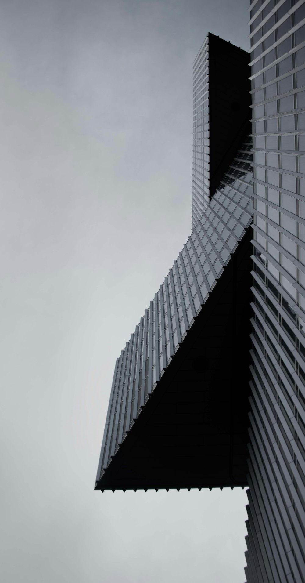 a very tall building with a sky background