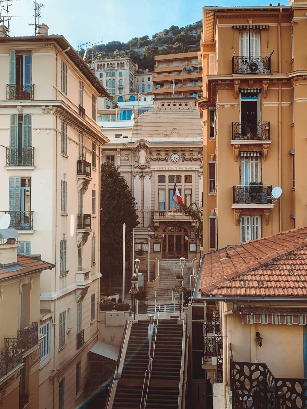 a group of buildings with stairs leading up to them