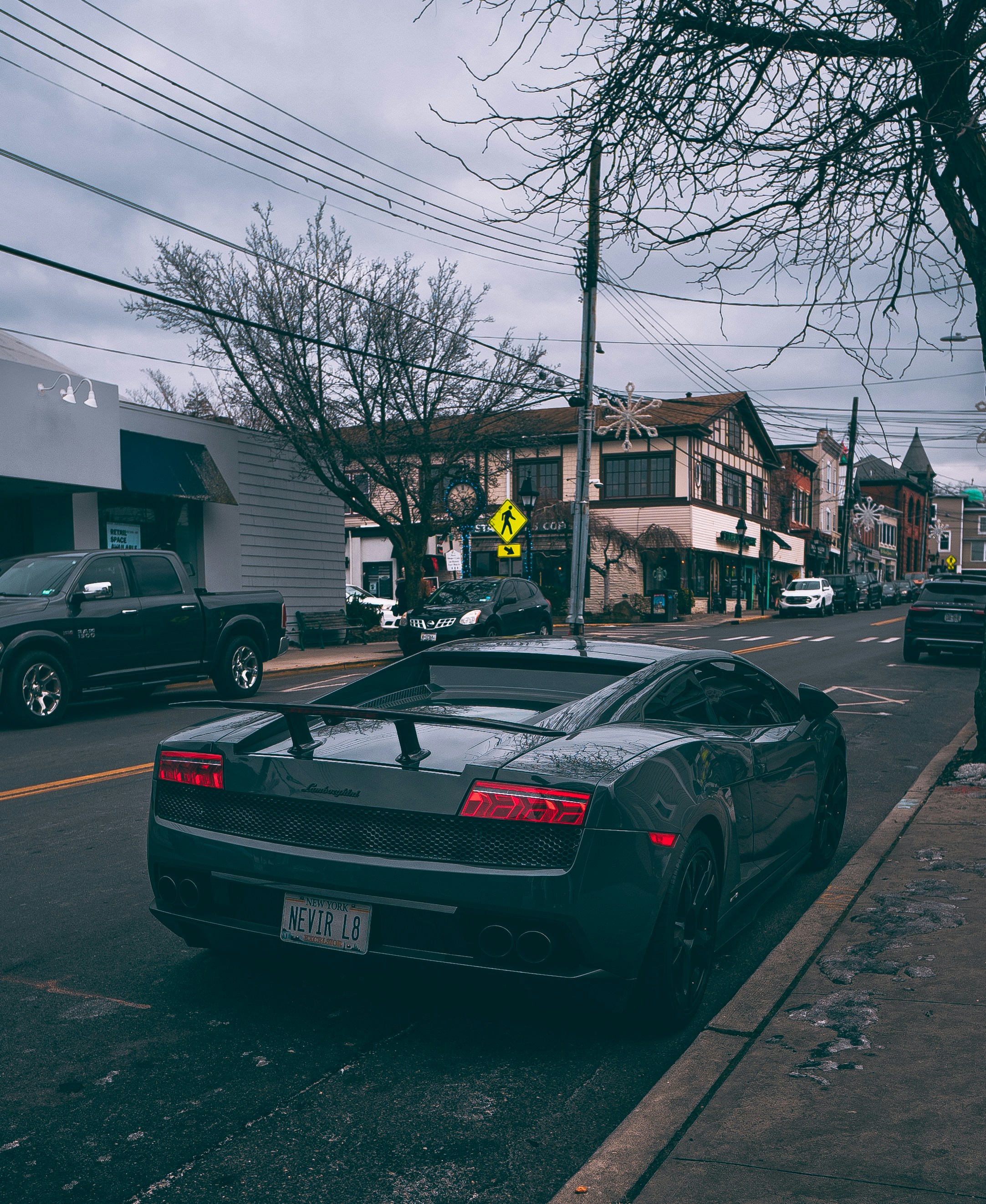 a black sports car parked on the side of the road