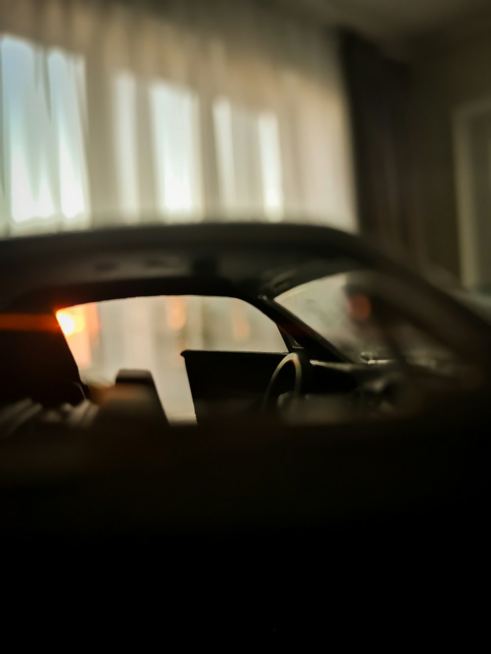 a close up of a car with the sun shining through the window