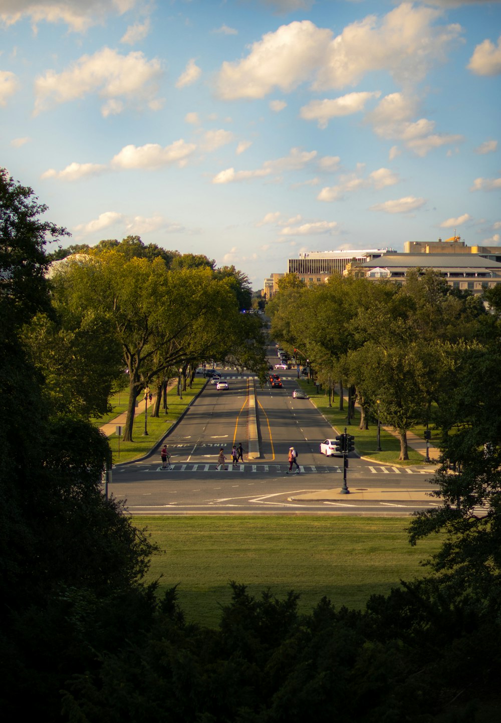 a view of a city street from a hill