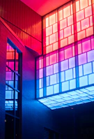 Artistic shot of a colorful volumetric design illuminated by soft natural light near a window.