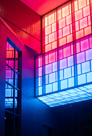 Artistic shot of a colorful volumetric design illuminated by soft natural light near a window.