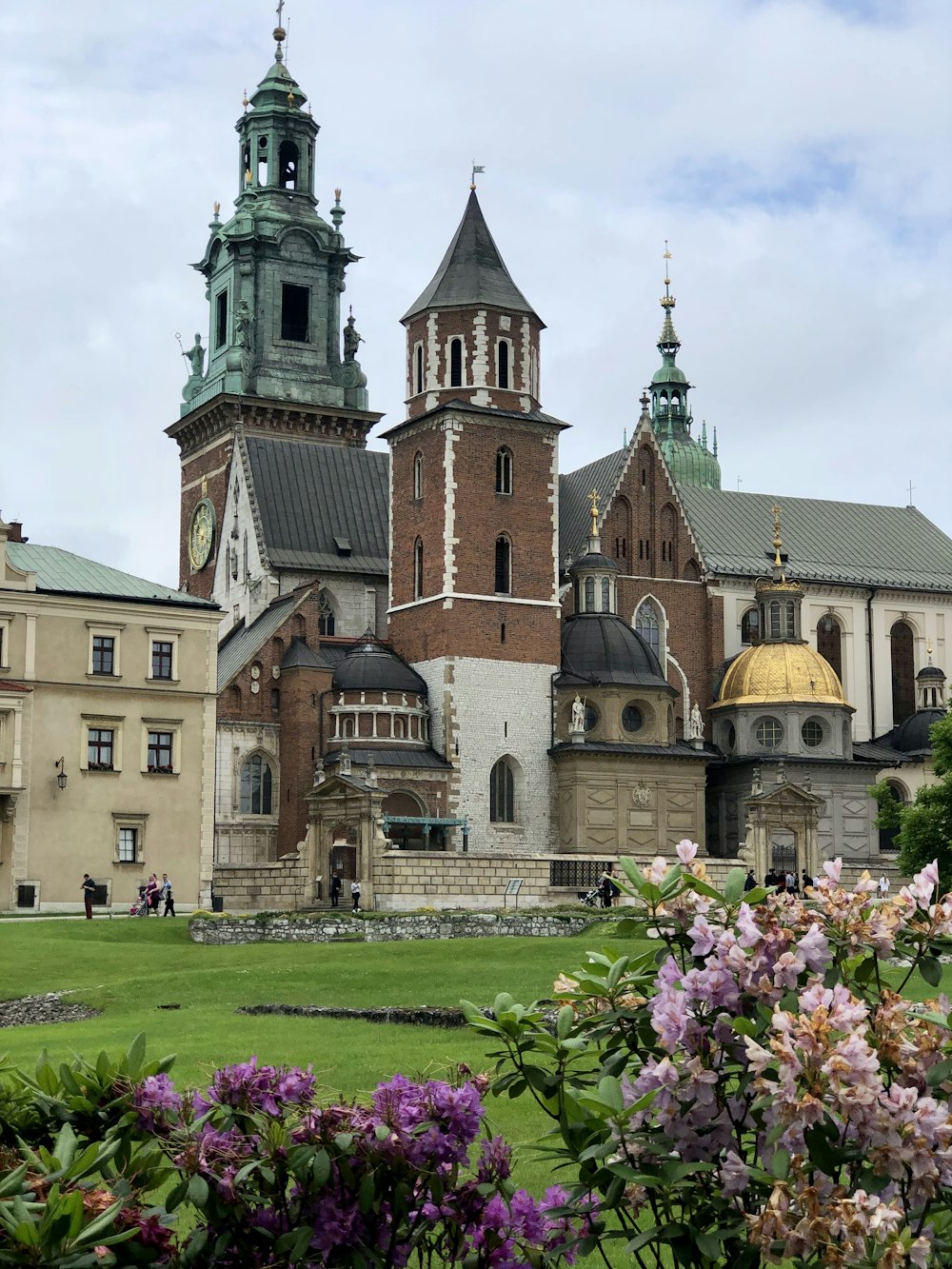 a large building with two towers and a clock tower