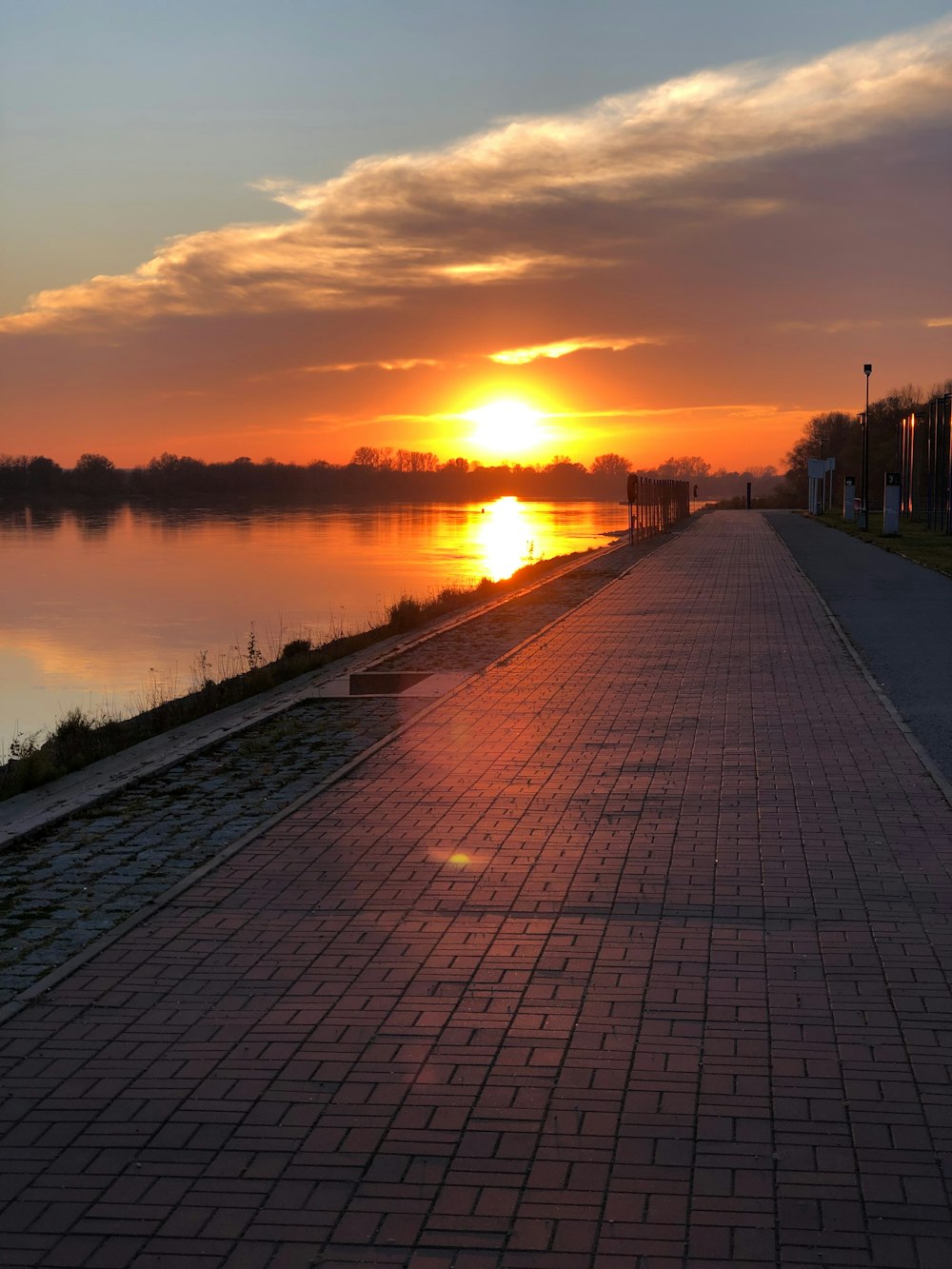 the sun is setting over a body of water