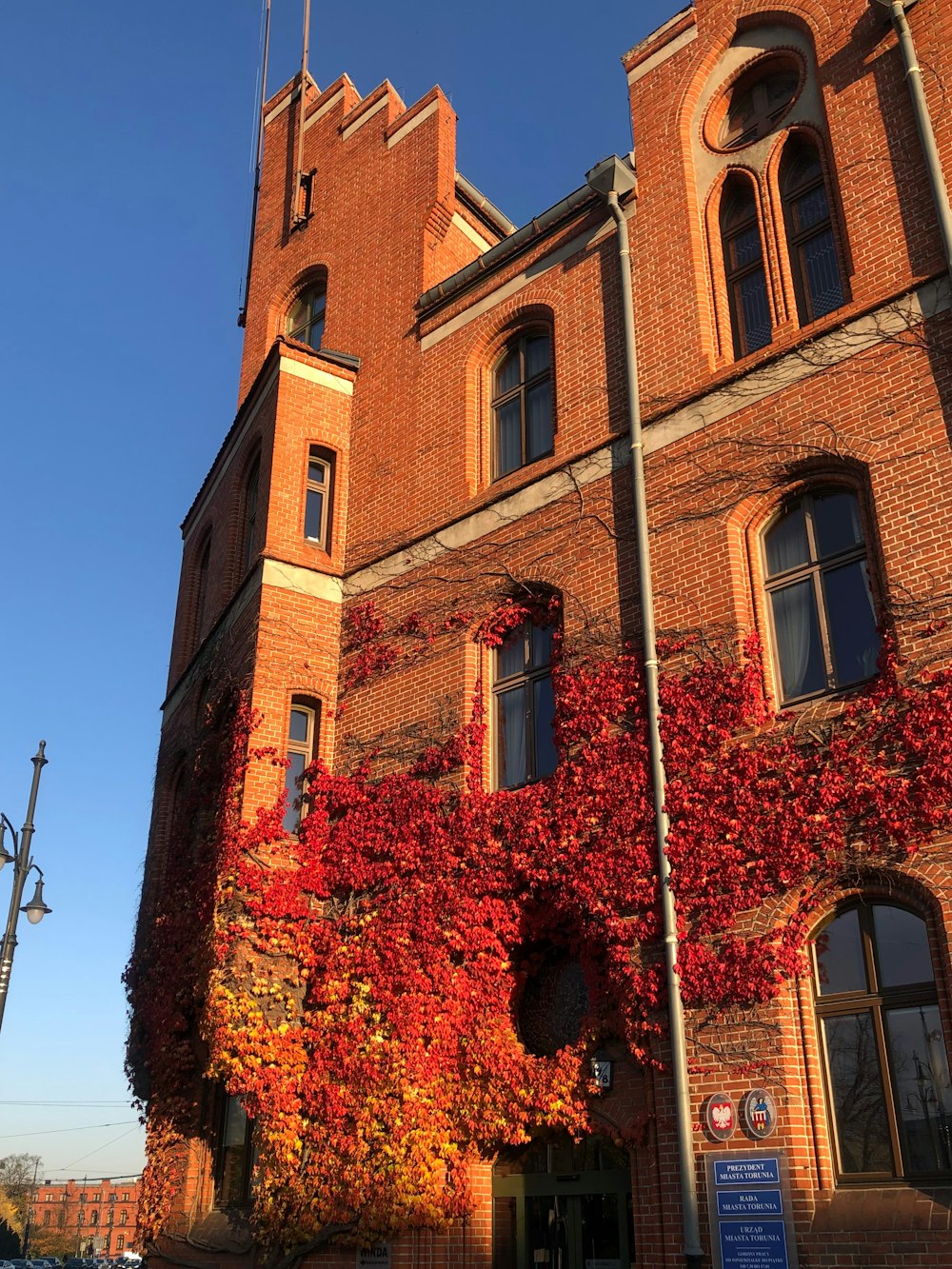 a tall brick building with a clock tower on top of it