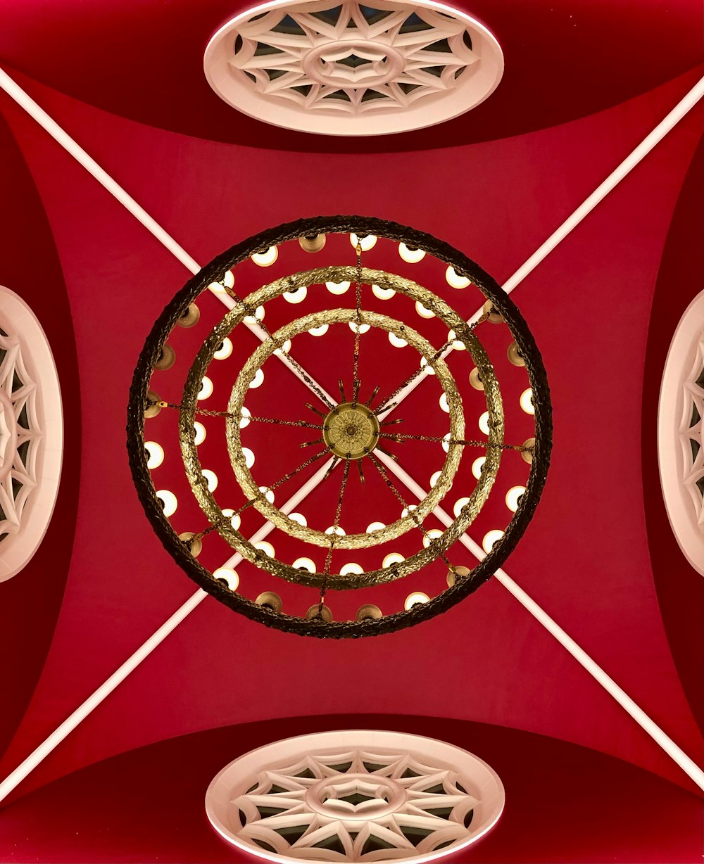 a red ceiling with a circular design on it